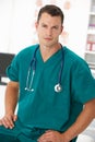 Young male doctor in consulting room