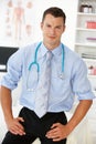 Young male doctor in consulting room Royalty Free Stock Photo