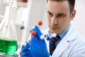 Young male doctor examining molecular structure in laboratory Royalty Free Stock Photo