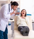 Young male doctor and female beautiful patient Royalty Free Stock Photo