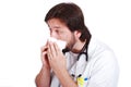 Young male doctor got fly and cleaning his nose wi Royalty Free Stock Photo