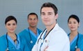 Young male Doctor with his team in the background Royalty Free Stock Photo