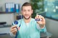 Young male doctor holding thermometer Royalty Free Stock Photo