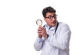 Young male doctor with a looking magnifying glass isolated on wh Royalty Free Stock Photo