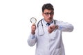 Young male doctor with a looking magnifying glass isolated on wh Royalty Free Stock Photo