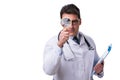 Young male doctor with a looking magnifying glass isolated on wh Royalty Free Stock Photo