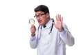 Young male doctor with a looking magnifying glass isolated on wh Royalty Free Stock Photo