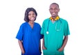 Young male doctor with nurse holding their hands in pockets Royalty Free Stock Photo