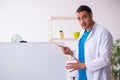 Young male doctor in presentation concept Royalty Free Stock Photo