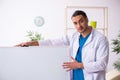 Young male doctor in presentation concept Royalty Free Stock Photo