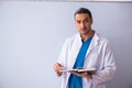 Young male doctor in presentation concept Royalty Free Stock Photo