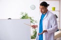 Young male doctor in presentation concept Royalty Free Stock Photo