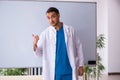 Young male doctor in presentation concept Royalty Free Stock Photo