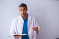 Young male doctor in presentation concept Royalty Free Stock Photo