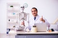 Young male doctor studying human skeleton Royalty Free Stock Photo