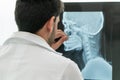 Young male doctor working with patient xray film. Royalty Free Stock Photo