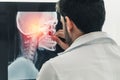 Young male doctor working with patient xray film. Royalty Free Stock Photo