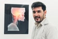 Young male doctor working with patient xray film. Royalty Free Stock Photo