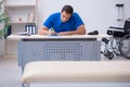 Young male doctor writing prescription in the clinic Royalty Free Stock Photo