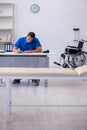 Young male doctor writing prescription in the clinic Royalty Free Stock Photo