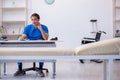 Young male doctor writing prescription in the clinic Royalty Free Stock Photo