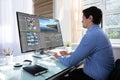 Editor editing video on computer Royalty Free Stock Photo