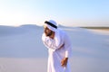 Young male emirate suffers from severe pains in abdomen, standin Royalty Free Stock Photo