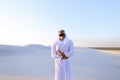 Young male emirate suffers from severe pains in abdomen, standin Royalty Free Stock Photo