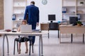 Young male employee and his little girl in the office Royalty Free Stock Photo