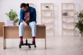 Young male employee in oversleeping concept Royalty Free Stock Photo