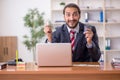 Young male employee playing cards at workplace Royalty Free Stock Photo