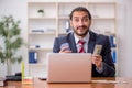 Young male employee playing cards at workplace Royalty Free Stock Photo