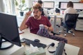 A young male employee is relaxed while working in the office. Employees, job, office Royalty Free Stock Photo