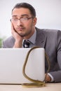 Young male employee with snake in the office Royalty Free Stock Photo