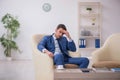 Young male employee waiting for business meeting Royalty Free Stock Photo