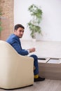 Young male employee waiting for business meeting Royalty Free Stock Photo