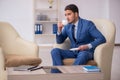 Young male employee waiting for business meeting Royalty Free Stock Photo