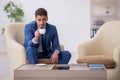 Young male employee waiting for business meeting Royalty Free Stock Photo