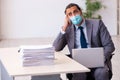 Young male employee wearing mask during pandemic Royalty Free Stock Photo