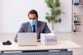 Young male employee wearing mask during pandemic Royalty Free Stock Photo