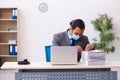 Young male employee wearing mask during pandemic Royalty Free Stock Photo