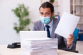 Young male employee wearing mask during pandemic Royalty Free Stock Photo