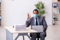 Young male employee wearing mask during pandemic Royalty Free Stock Photo