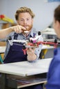 young male engineer or technician programs drone Royalty Free Stock Photo