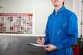 Young male engineer at work in mechanic tools storage room Royalty Free Stock Photo