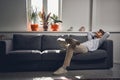 Young male entrepreneur relaxing in his office