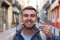 Young male faking a smile with clothespins Royalty Free Stock Photo