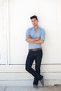 Young male fashion model in blue jeans and shirt Royalty Free Stock Photo