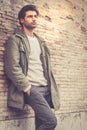Young male fashion street on wall Royalty Free Stock Photo