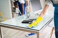 Male And Female Cleaners Cleaning Office Royalty Free Stock Photo